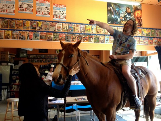 Jay Bardyla on a horse, in his store.